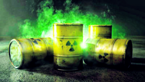 Image of yellow drums with the nuclear symbol on them.