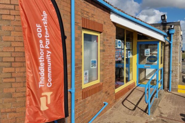 The Dunes Complex building with the CP flag flying outside the entrance