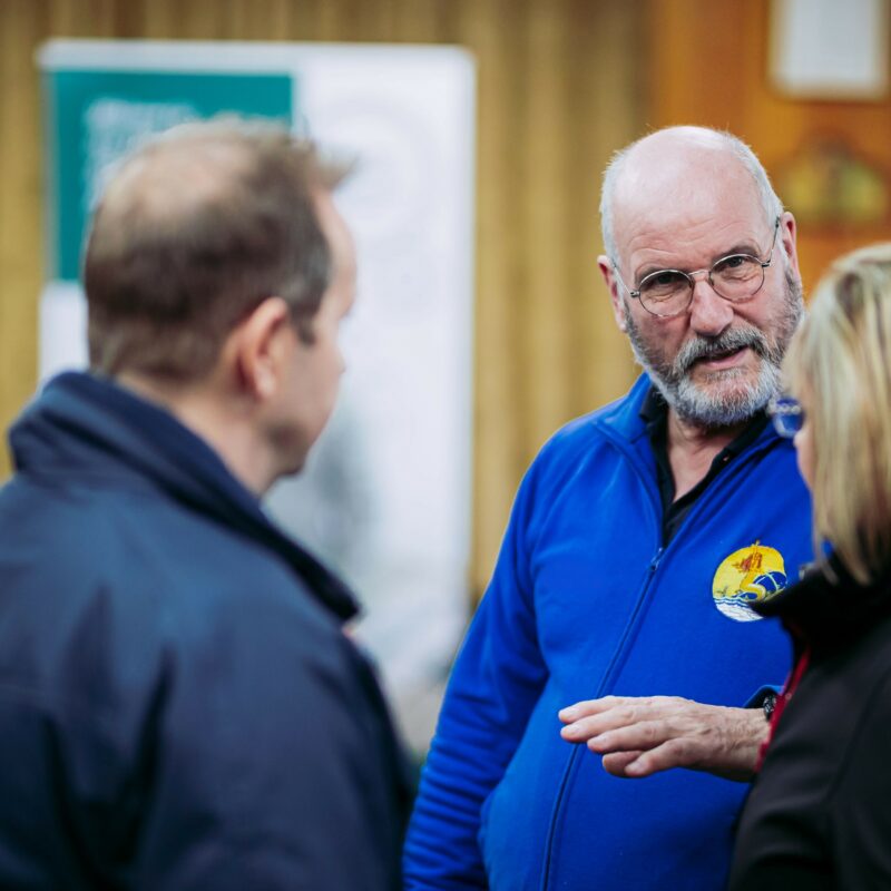 CP member Gareth talking to a man and lady